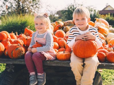 Young kids at a pumpkin patch